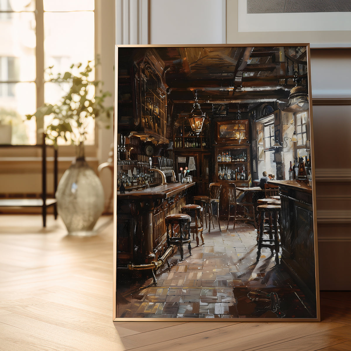 A framed vertical painting of a dimly lit, rustic bar interior with wooden counters, stools, shelves, and warm hanging lights, displayed leaning against a wall on a light wood floor in a softly blurred room.