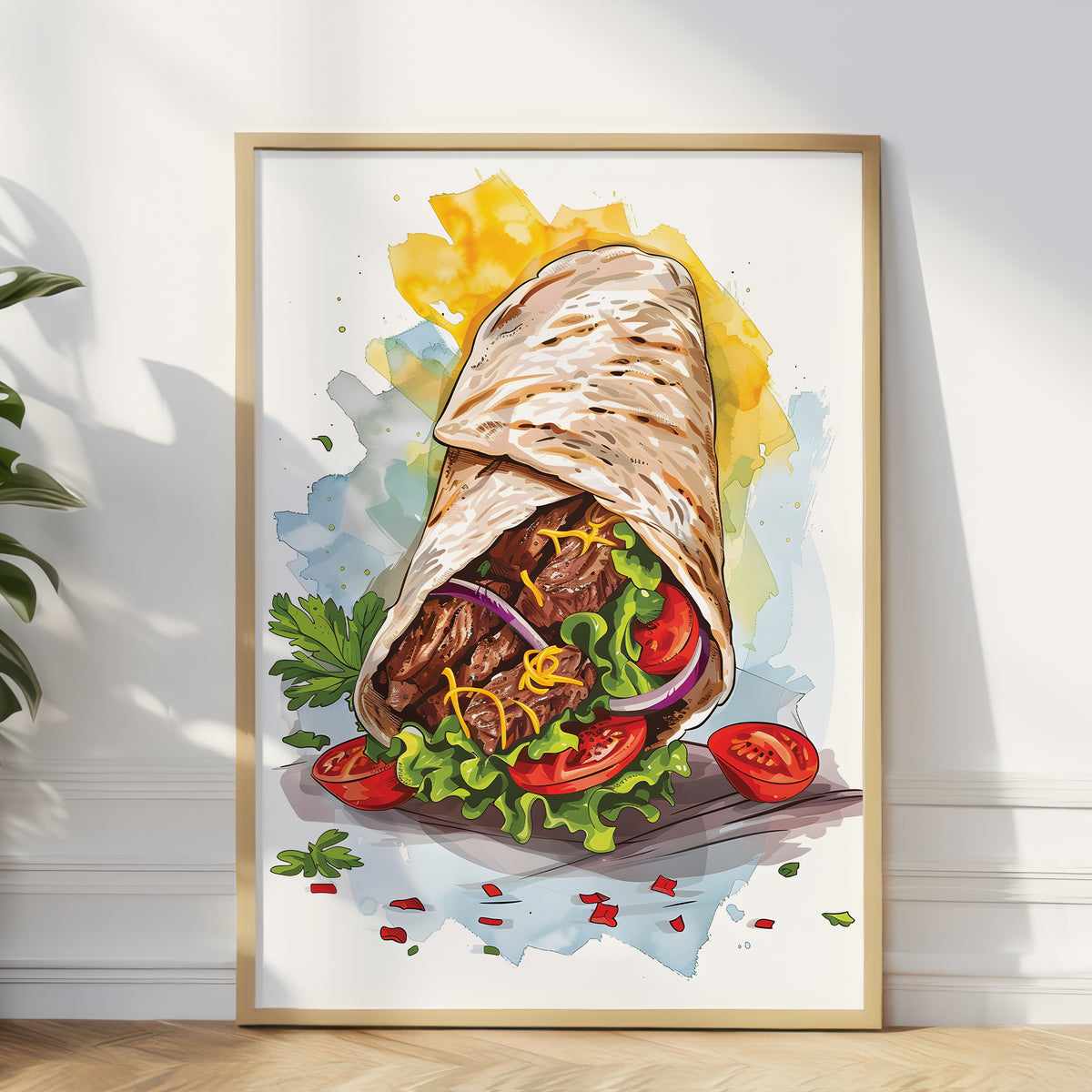 A framed watercolor-style art print of a gourmet wrap or burrito, leaning against a white wall on a light wood floor. The print features a detailed illustration of the wrap filled with meat, lettuce, tomato, and red onion, with yellow watercolor splashes in the background.