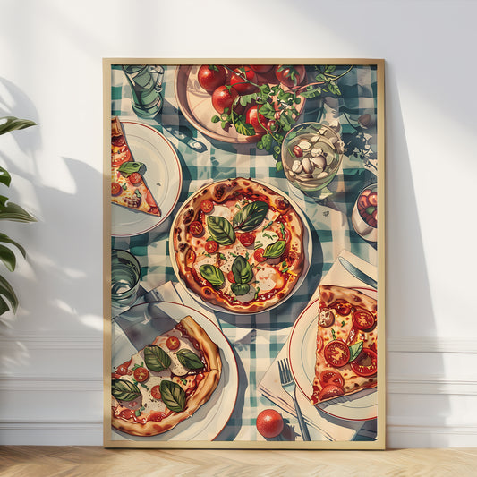 A framed vertical art print depicting a rustic Italian table setting with fresh pizzas topped with basil and tomatoes, alongside plates, glasses, and a checkered tablecloth, leaning against a white wall on a light wood floor.