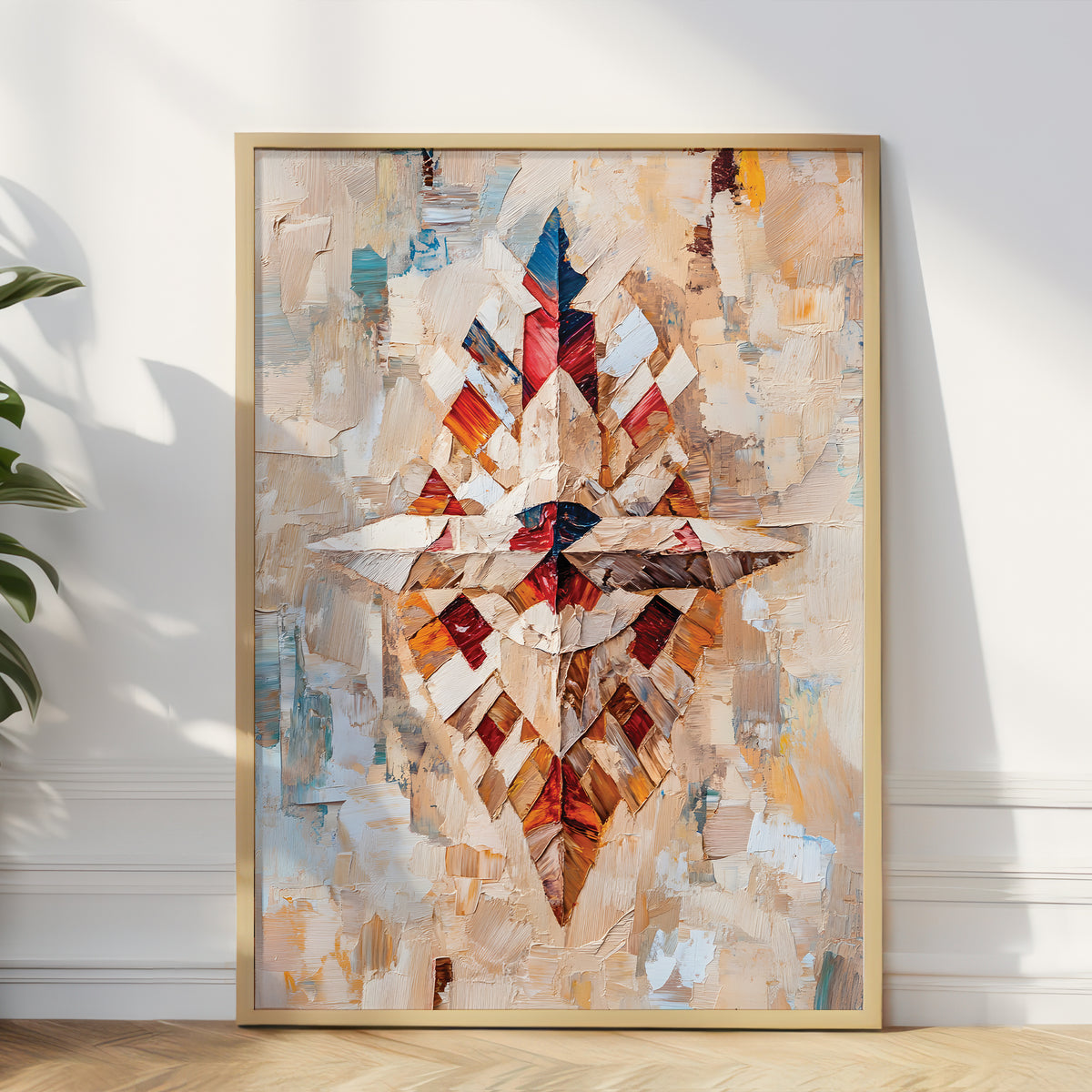 A framed abstract canvas print leaning against a white wall on a light wood floor, featuring a geometric diamond pattern in beige, brown, red, blue, and white tones.