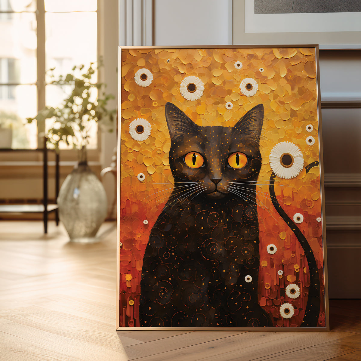 A framed vertical canvas painting of a black cat with glowing yellow eyes, set against a textured orange and gold background with white flower motifs, displayed leaning against a wall in a bright, modern room.