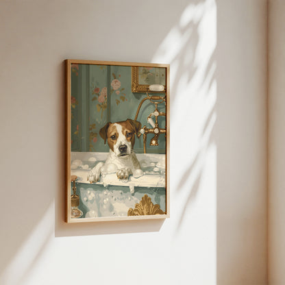 A framed art print depicting a small white and brown dog sitting in a bathtub with floral wallpaper and gold fixtures, hanging on a beige wall with soft sunlight and leaf shadows.