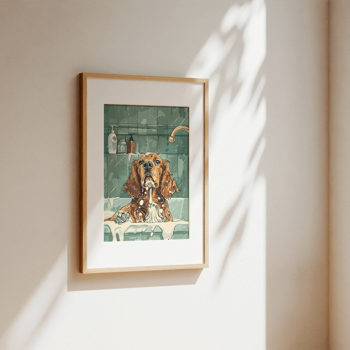 A framed art print featuring a watercolor-style illustration of a brown dog in a bathtub, hung on a beige wall with soft sunlight and leaf shadows.