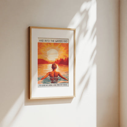 Framed artwork of a person in water with a sunset and text on a wall.