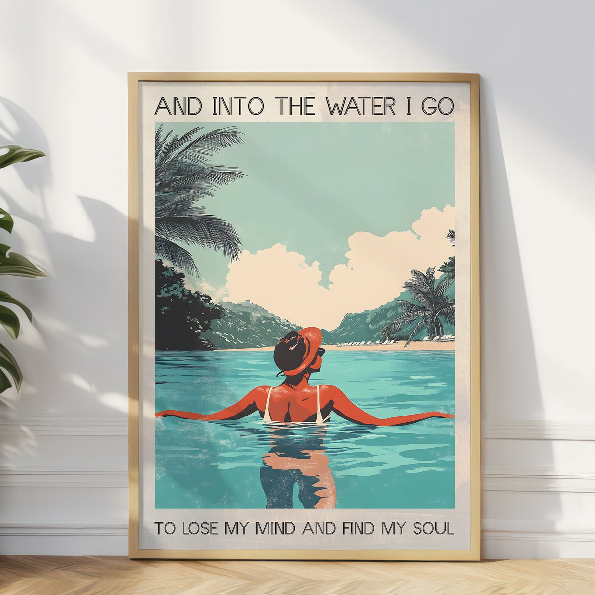 Framed poster of a woman in a swimsuit sitting in water with palm trees and a quote.