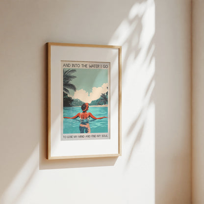 Framed artwork of a woman in a pool with palm trees and text on a beige wall.