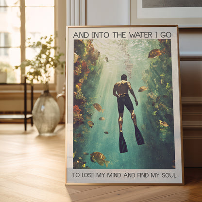 Framed poster of a diver underwater with text in a room with a plant and window.