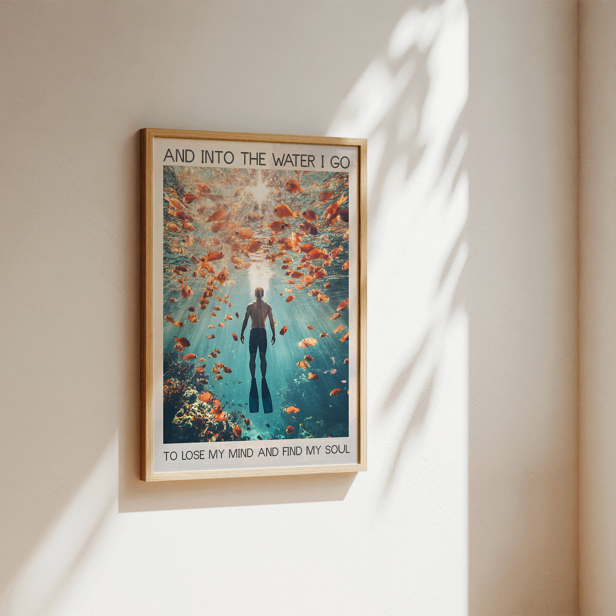 underwater ocean and person underwater with many golden fish around with quote wall art print