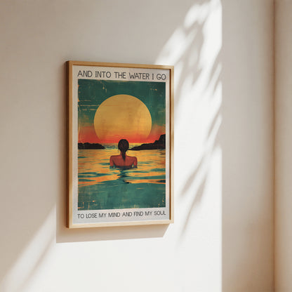 Framed poster with a sunset design and text on a wall.