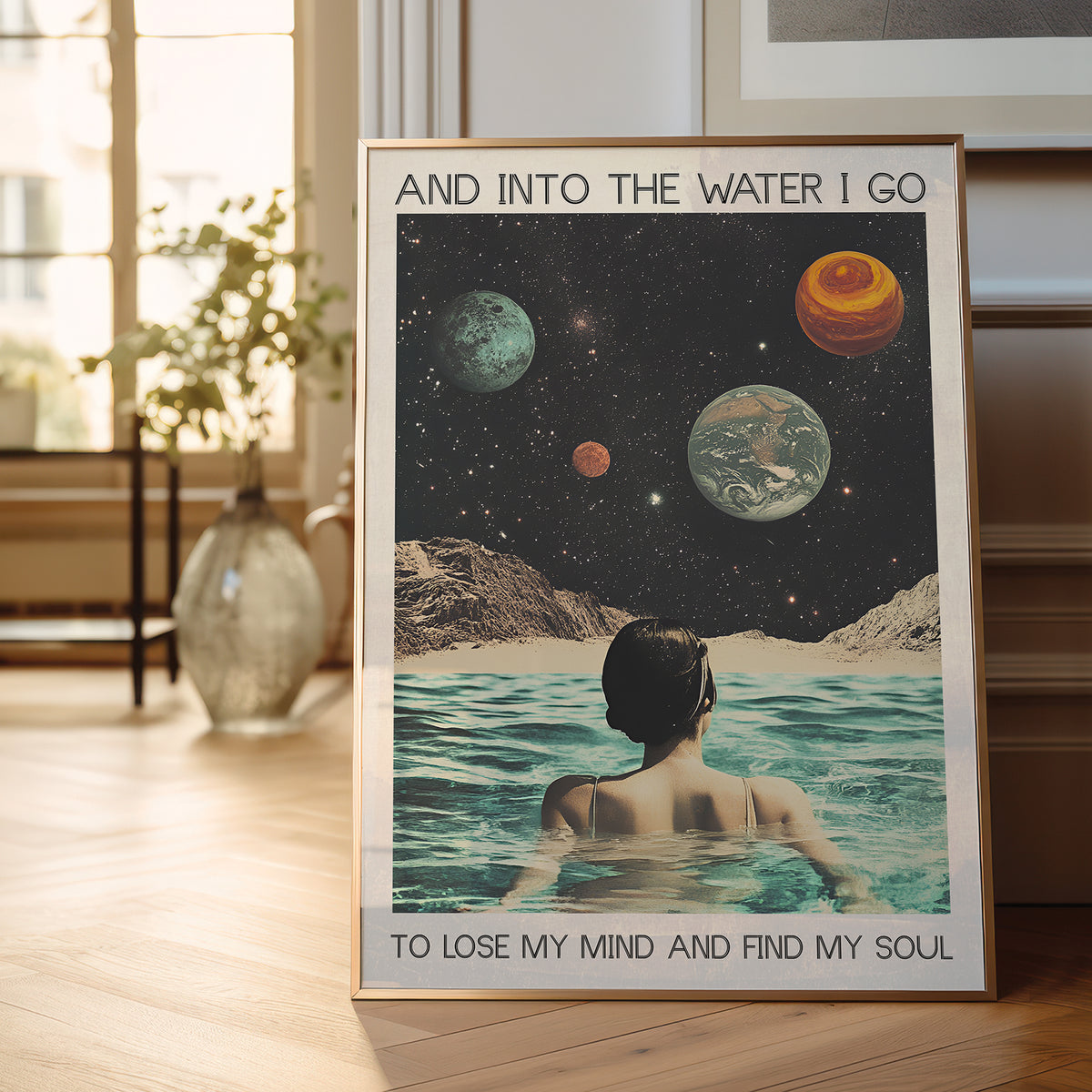 Framed poster of a person in water with celestial background in a room.