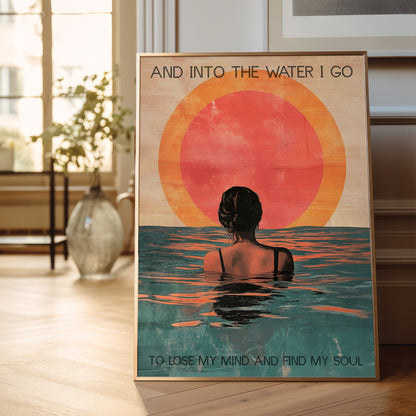 Poster of a woman in water with a sunset and text in a room.