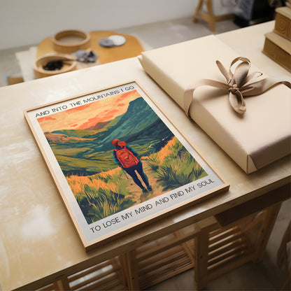 Poster of a person in a red jacket with text on a table next to a wrapped gift.
