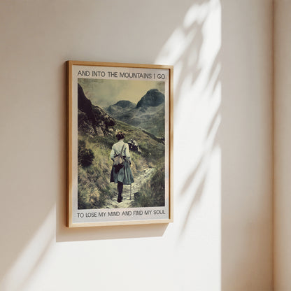 Framed poster of a person hiking with mountains in the background, text 'And into the mountains I go to lose my mind and find my soul'.