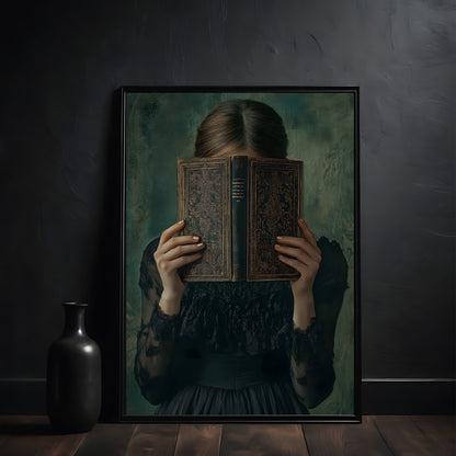 Framed artwork of a woman holding an old book in front of her face against a dark wall.