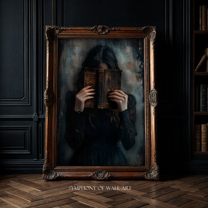 Framed artwork of a person holding an old book in a dark room with bookshelves.