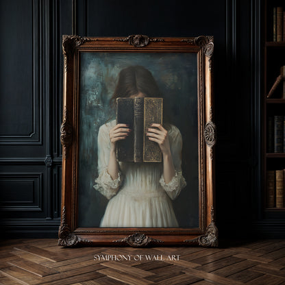 Framed artwork of a woman holding books in front of her face against a dark wall.
