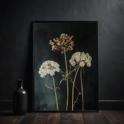 Framed artwork of dried flowers on a dark background