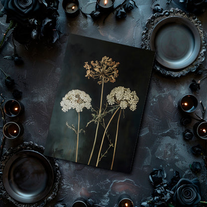 Dark table setting with floral arrangement and candles