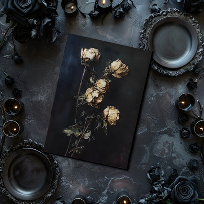 Dark table setting with dried roses, candles, and decorative plates.