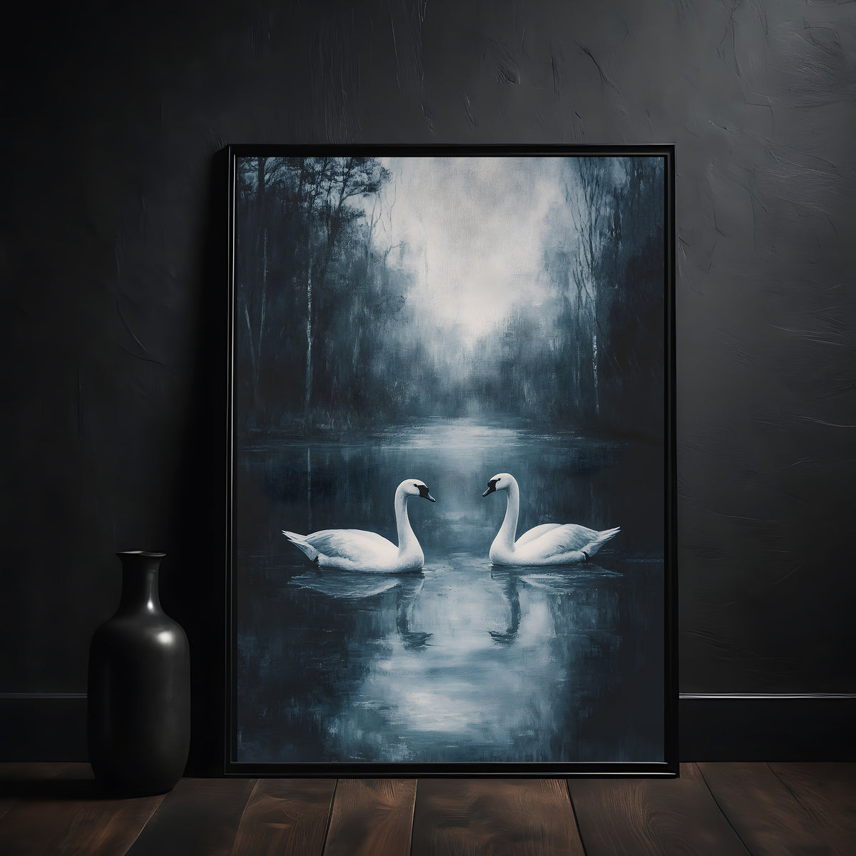 Framed artwork of two swans on a misty lake with a dark vase on a wooden surface.