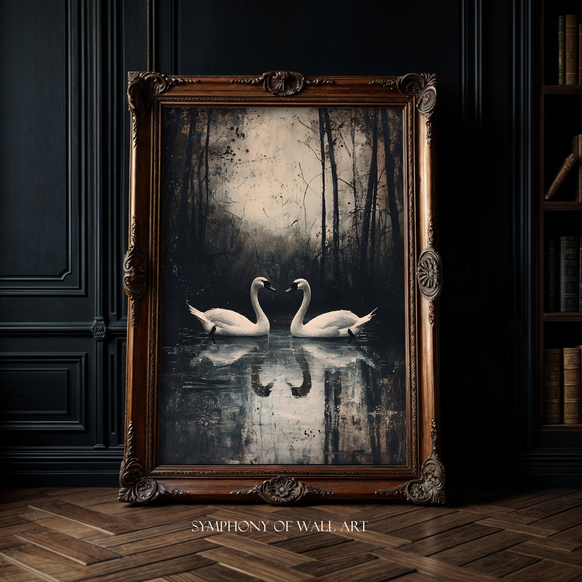 Framed artwork of two swans on a dark background in a room with wooden floor and bookshelf.