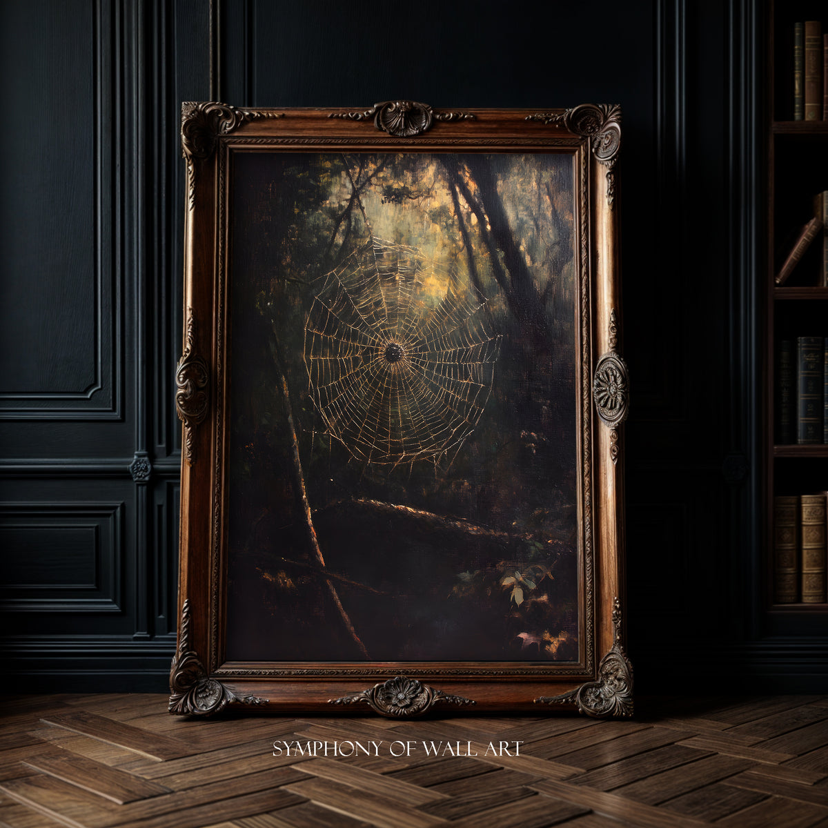 Framed artwork of a spider web in a dark room with bookshelf