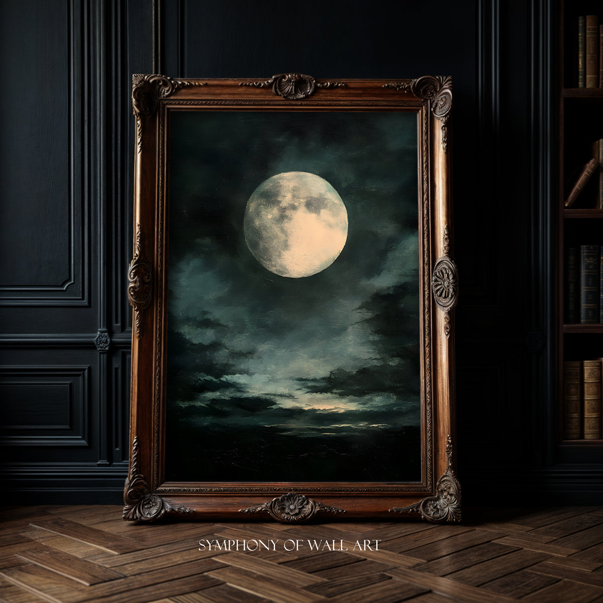 Framed artwork of a moonlit sky with clouds in a dark room.