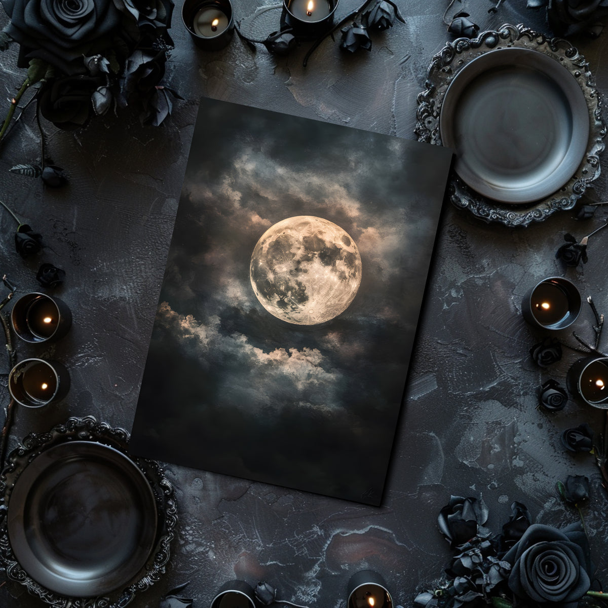 Table setting with a moonlit sky print, candles, and dark flowers on a textured surface.