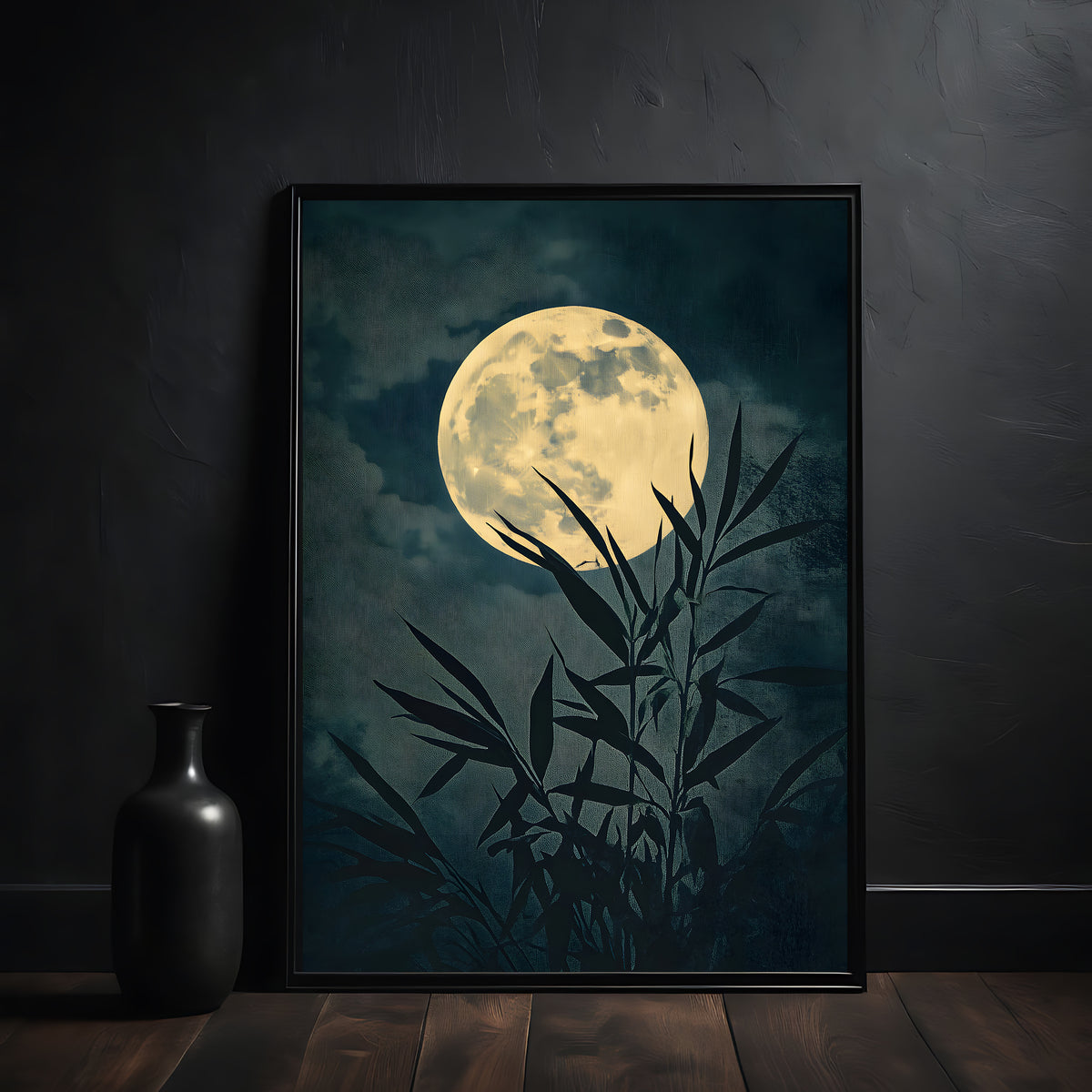 Framed artwork of a moon and bamboo leaves on a dark background