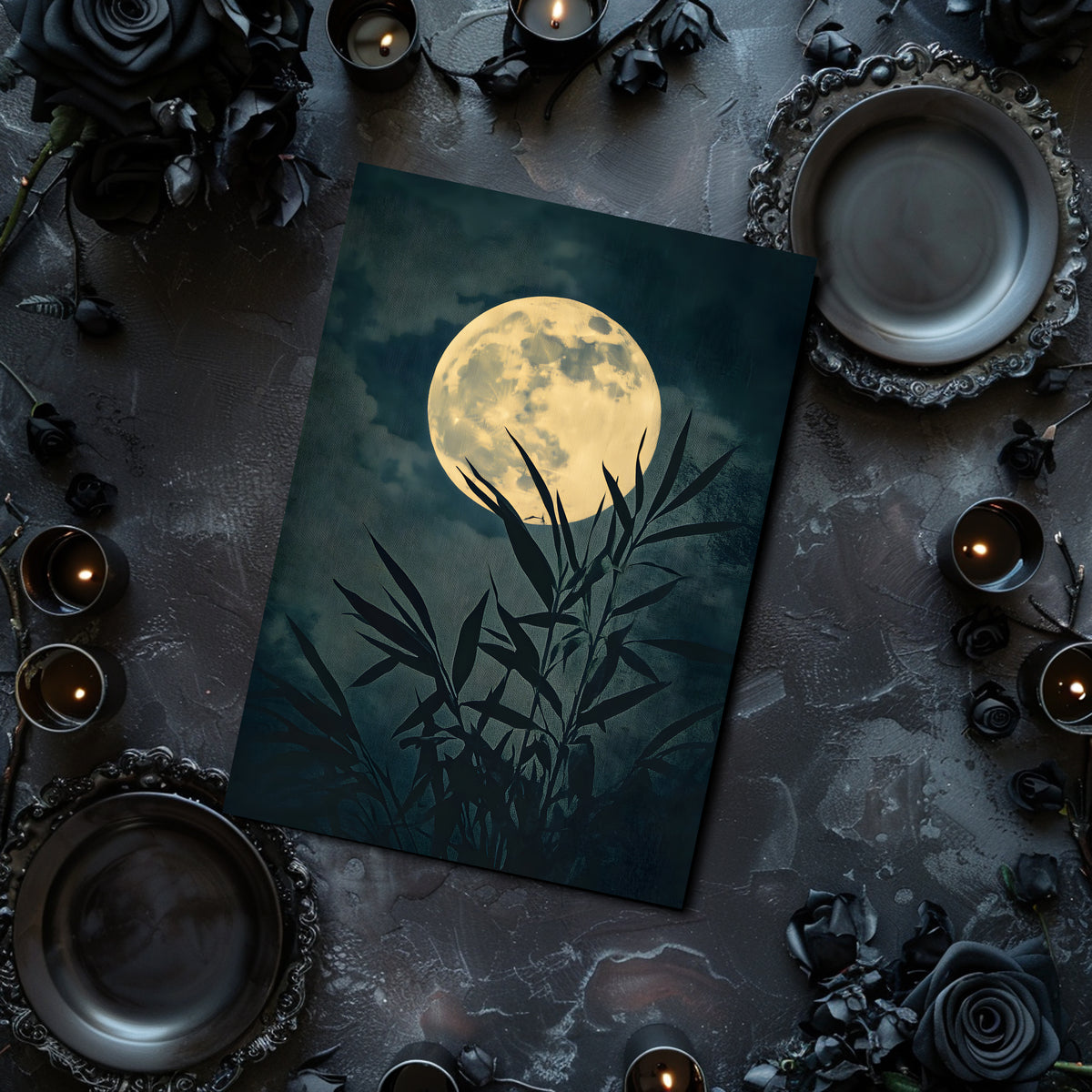 Poster with a moon and bamboo design on a dark surface with candles and black roses.