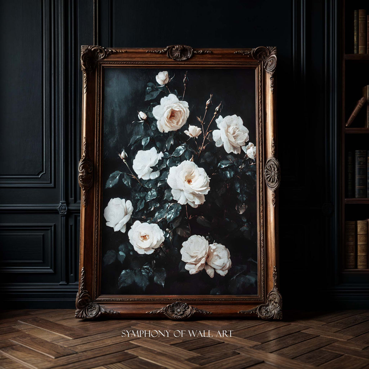 Framed artwork of white flowers on a dark background, displayed in a room with wooden flooring and bookshelf.