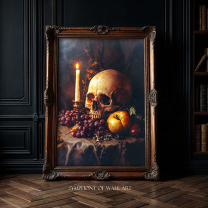 Framed artwork of a still life with a skull, candle, and fruit on a dark background.