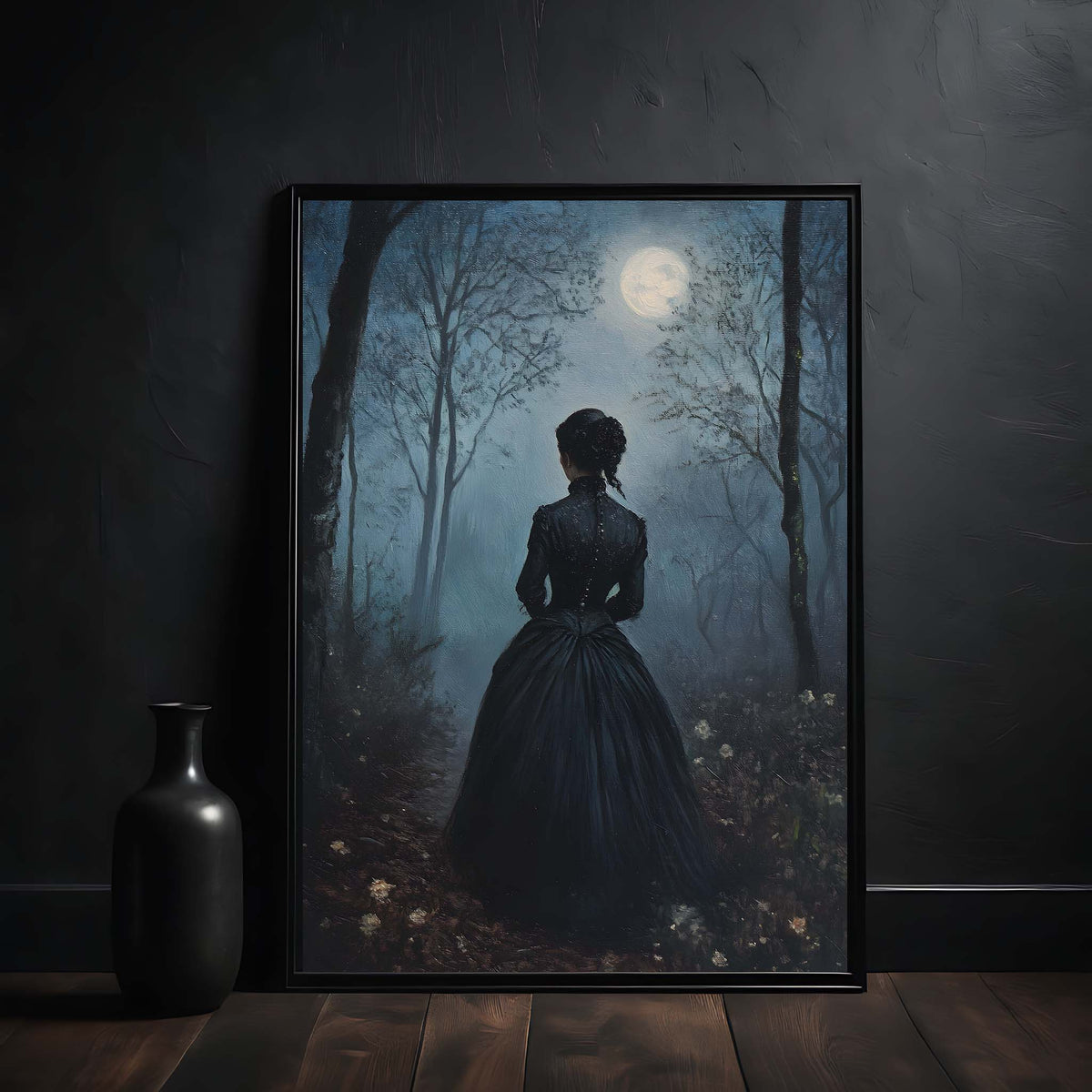 Framed artwork of a woman in a dark forest with a full moon, displayed on a dark wall.