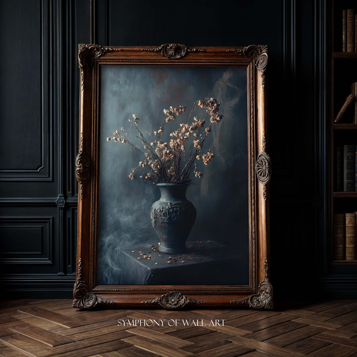 Framed painting of a vase with flowers on a dark background, displayed in a room with wooden floor and bookshelf.