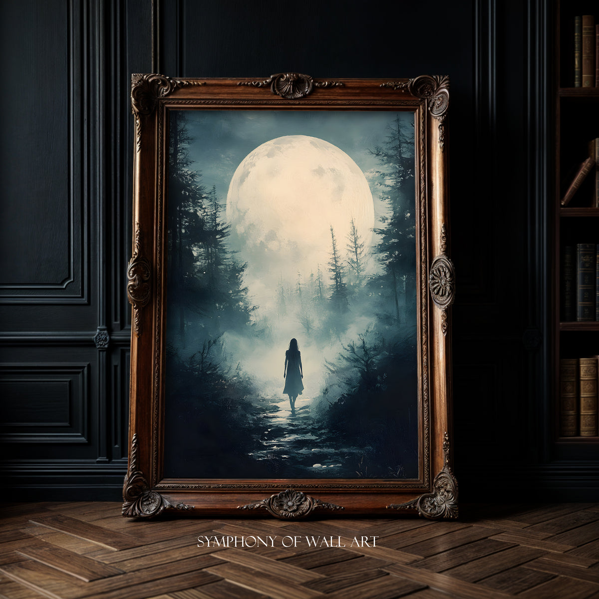 Framed artwork of a person walking through a forest under a large moon, displayed on a dark wall.