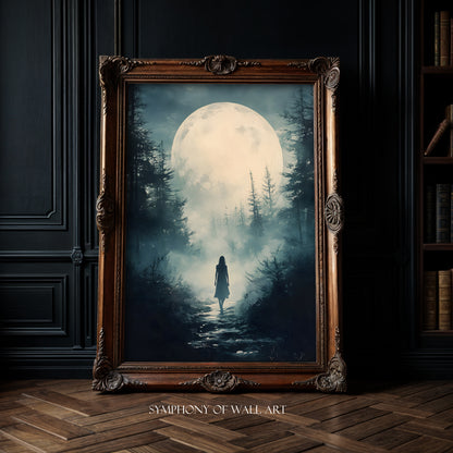 Framed artwork of a person walking through a forest under a large moon, displayed on a dark wall.