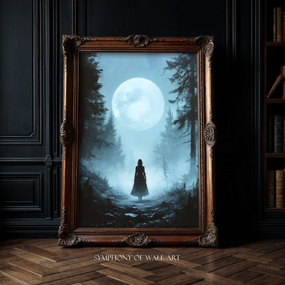 Framed artwork of a silhouette under a moonlit sky with trees, displayed in a room.