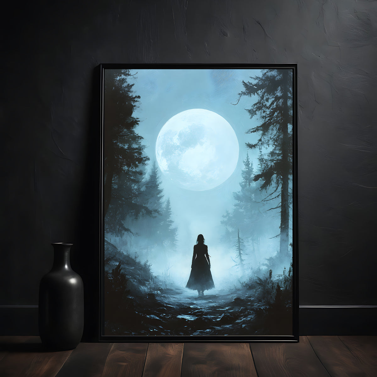 Framed artwork of a silhouette of a person in a forest under a large moon.