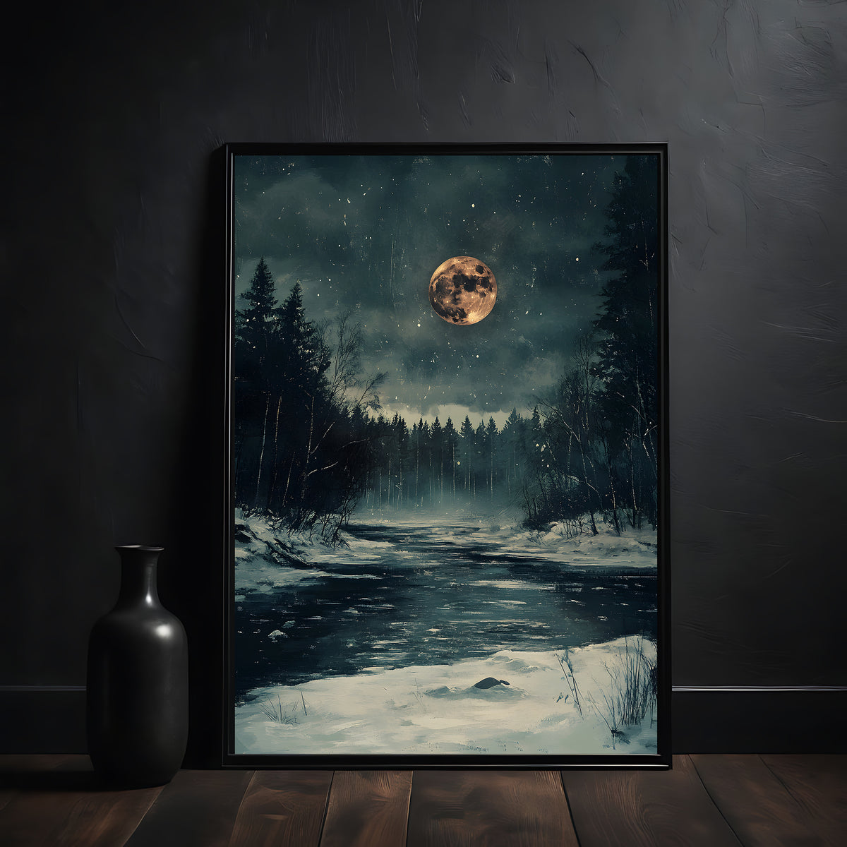 Framed artwork of a snowy forest scene with a full moon on a dark wall.
