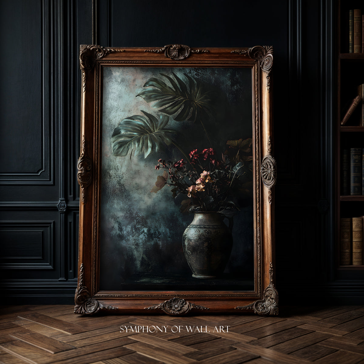 Decorative framed artwork with a vase and monstera leaves on a dark wall.